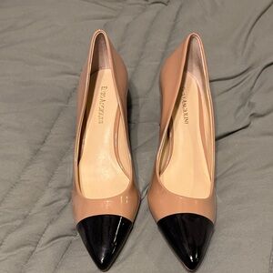 Tan and black cap toe pumps